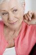 A senior woman sitting on a sofa