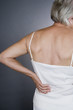A senior woman with backache