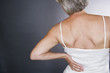 A senior woman with backache
