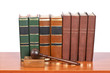 Wooden gavel and old law books