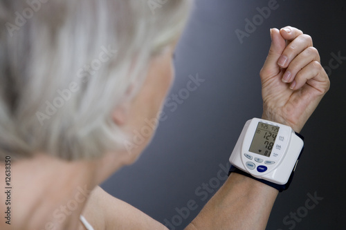 Photo: A senior woman with a heart rate monitor on her wrist A senior woman with a heart rate monitor on her wrist