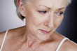 A senior woman crying