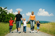 Family walking a dirtroad