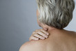 A senior woman with back ache