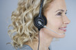 A middle aged woman wearing a headset