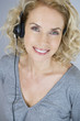 A middle aged woman wearing a headset