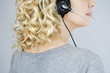 A middle aged woman wearing a headset