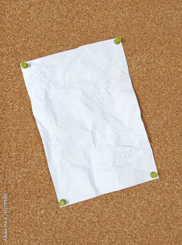 Photo: Crumpled paper pinned to corkboard Crumpled paper pinned to corkboard