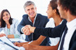 Successful business colleagues shaking hands with eachother