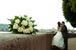bouquet of roses and couple on the background