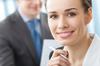 Portrait of businesswoman and colleague on background