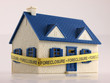 House with Foreclosure tape ground view