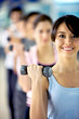Girl lifting small freeweights