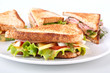 meat, lettuce and cheese club sandwich on toasted bread meat, lettuce and cheese club sandwich on toasted bread