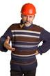 men in a red helmet with a pipe in a hand