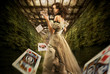 Vintage female magician throwing playing cards