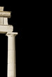 Ancient Greek pillar (part of a temple) in black background.