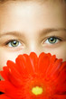 smiling beautiful  young girl with flower at spring