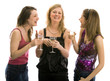 Three beautiful girls celebrating. Isolated in white