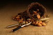 Assortment of nuts in basket with nutcracker