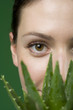 Photo: Close up woman and aloe plant Close up woman and aloe plant