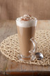 coffee latte macchiato with cream in glass on old table backgrou coffee latte macchiato with cream in glass on old table backgrou