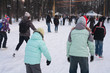 People on skating rink in park