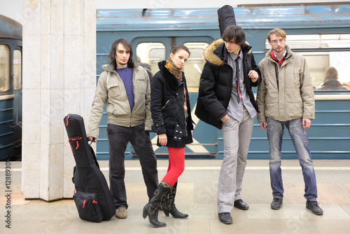 Photo: Four young musicians at metro station Four young musicians at metro station