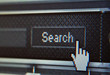 Extreme Closeup of Mouse Cursor over Search Button
