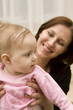 Photo en ligne au meilleur prix Mother and baby playing in home