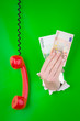 Foto: Hand with money and phone Hand with money and phone