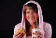 woman with hamburger and beverage