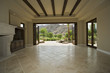 Empty Living Room with Stone Floor and Patio Access