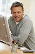 Photo: Man Using Computer Man Using Computer