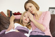 Photo: Mother Taking Temperature Of Sick Daughter Mother Taking Temperature Of Sick Daughter