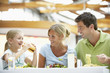 Family Having Lunch Together At The Mall