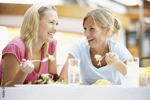 Photo: Female Friends Having Lunch Together At The Mall Female Friends Having Lunch Together At The Mall