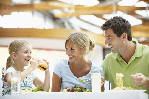 Photo: Family Having Lunch Together At The Mall Family Having Lunch Together At The Mall