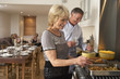 Couple Preparing Food For A Dinner Party