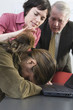Photo: View of business people consoling colleague. View of business people consoling colleague.
