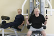 Senior couple exercising in the gym.
