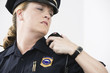 View of woman police officer on her radio.