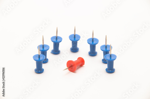 Photo: Blue push-pins isolated on white background with one fallen Blue push-pins isolated on white background with one fallen
