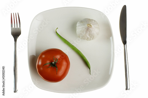 Photo: Plate with tomato green bean and garlic. Isolated on white. Plate with tomato green bean and garlic. Isolated on white.