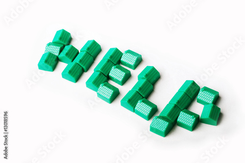 Photo: Model plastic houses/homes forming the word HELP. Model plastic houses/homes forming the word HELP.