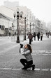 tourist girl taking photos on a street tourist girl taking photos on a street
