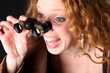 astonished woman with binoculars