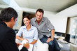 Happy young couple discussing investment plans Happy young couple discussing investment plans