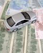 The silvery car on euro and dollars