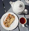 Sweet and light breakfast - a slice of Italian cake with tea Sweet and light breakfast - a slice of Italian cake with tea